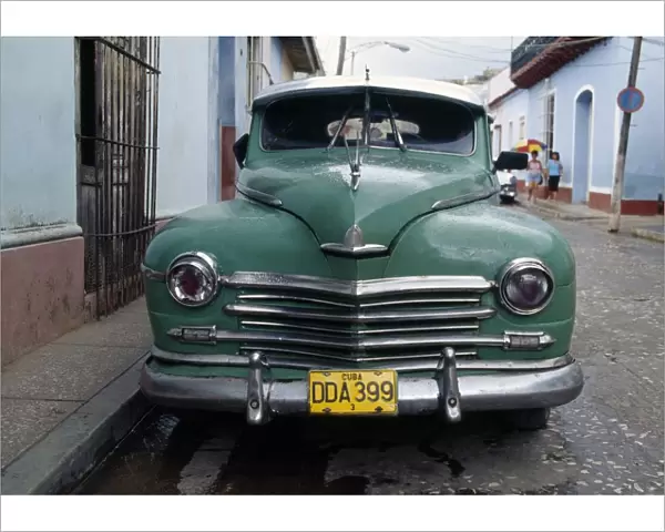 Old blue car parked in street, Havana, Cuba