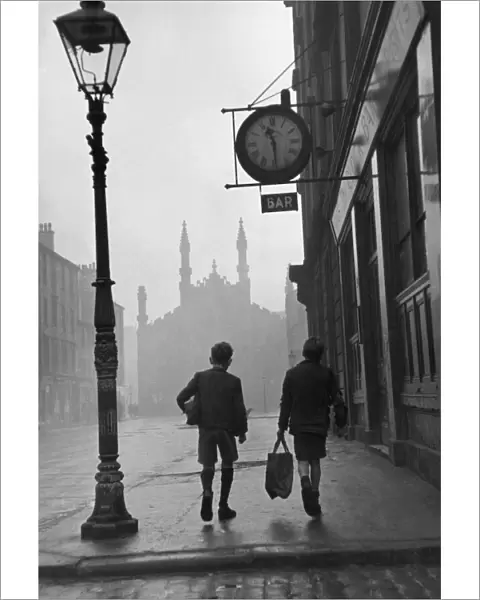 Gorbals area of Glasgow; Two young boys walking along a street in 1948