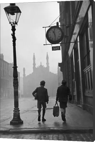 Gorbals area of Glasgow; Two young boys walking along a street in 1948