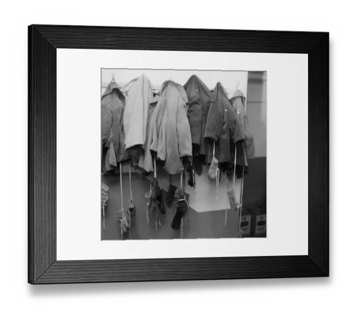 Framed Print : Winter Wear; row of small coats and mittens hanging Framed Print : Winter Wear; row of small coats and mittens hanging