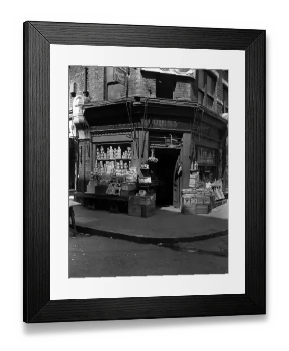 Framed Print : The Corner Shop; : A London grocers with goods on display outside Framed Print : The Corner Shop; : A London grocers with goods on display outside