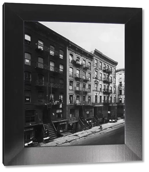 circa 1935: Exterior view of tenement buildings along Ridge Street on the Lower East Side