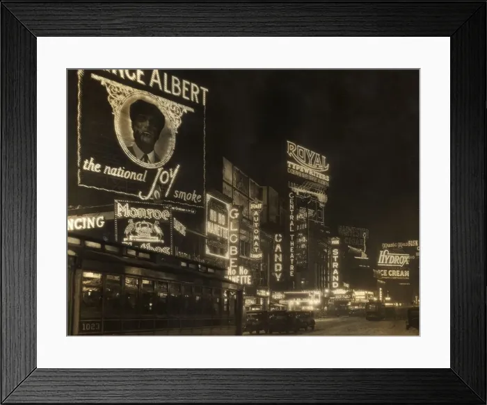 Framed Print : circa 1926: Automobiles and a streetcar pass illuminated theater marquees and billboards Framed Print : circa 1926: Automobiles and a streetcar pass illuminated theater marquees and billboards
