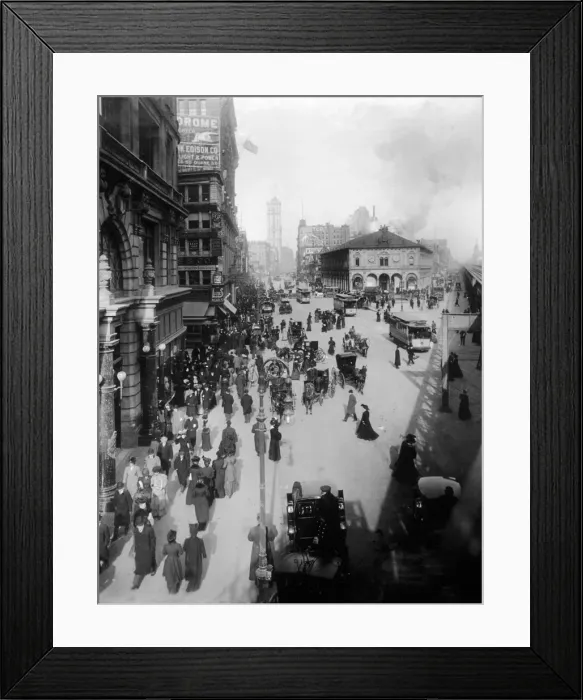 Framed Print : circa 1902: Crowds of people move through Herald Square on foot, in horse drawn carriages