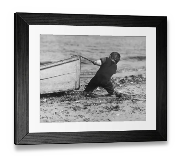 Framed Print : Stuck In The Mud; young boy in a swimsuit stands ankle-deep in mud on beach using Framed Print : Stuck In The Mud; young boy in a swimsuit stands ankle-deep in mud on beach using