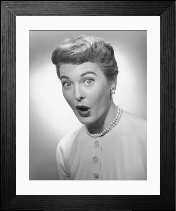 Framed Print : Woman making face in studio, (B&W), portrait Framed Print : Woman making face in studio, (B&W), portrait