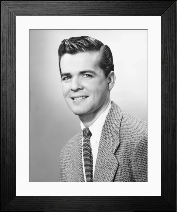 Framed Print : Young man smiling, (B&W), portrait