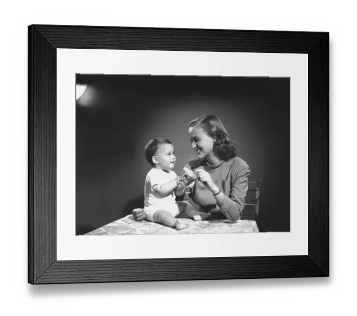 Framed Print : Mother with baby (6-9 months) playing at home, (B&W) Framed Print : Mother with baby (6-9 months) playing at home, (B&W)