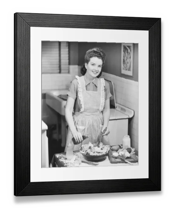 Framed Print : Woman preparing salad in kitchen, (B&W) Framed Print : Woman preparing salad in kitchen, (B&W)