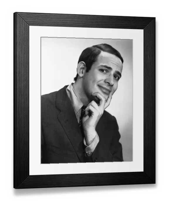 Framed Print : Smiling man posing in studio, (B&W), portrait Framed Print : Smiling man posing in studio, (B&W), portrait