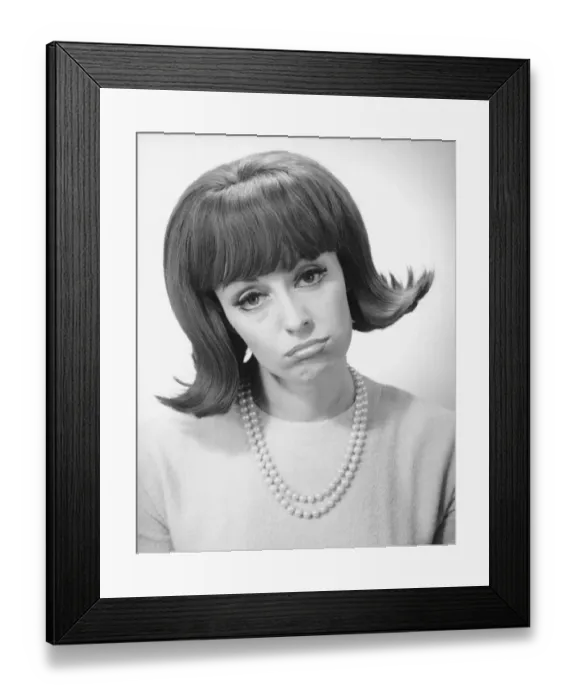 Framed Print : Smiling woman grimacing in studio, (B&W), portrait Framed Print : Smiling woman grimacing in studio, (B&W), portrait