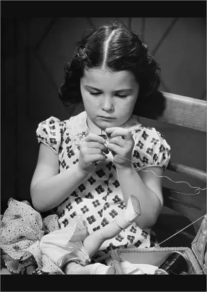 Girl (6-7) threading needle, (B&W)