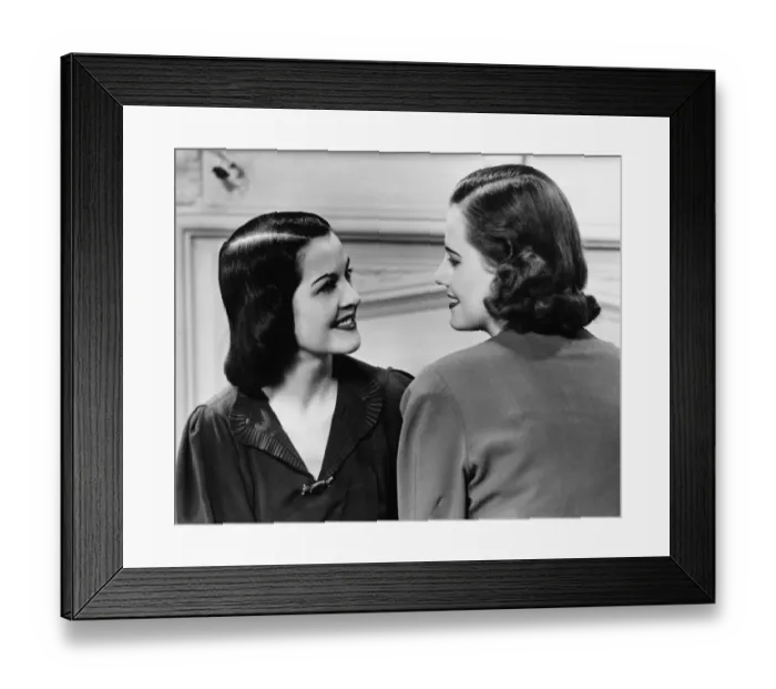 Framed Print : Two women conversing in living room, (B&W) Framed Print : Two women conversing in living room, (B&W)