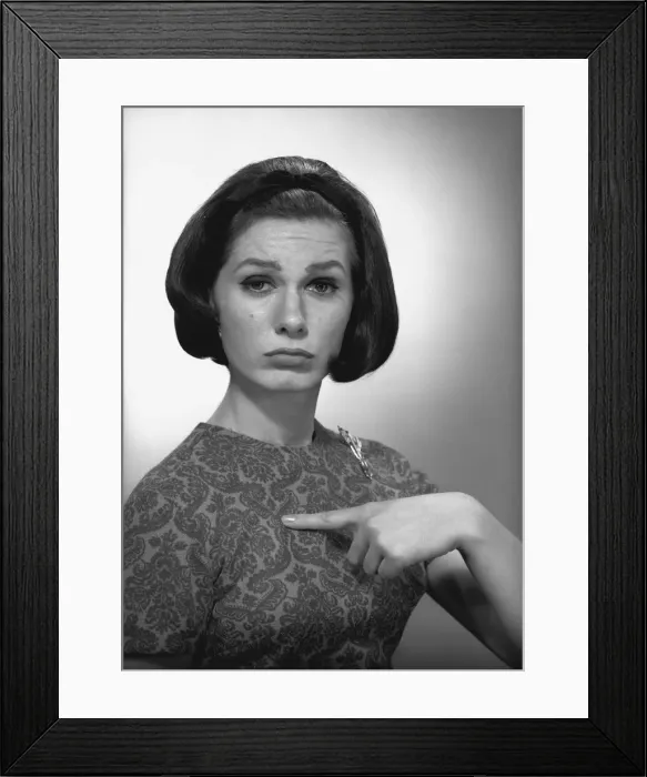 Framed Print : Woman pointing on herself in studio, (B&W), portrait