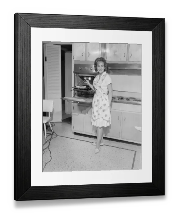 Framed Print : Portrait of woman cooking in kitchen Framed Print : Portrait of woman cooking in kitchen