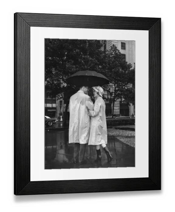 Framed Print : Man and woman under umbrella, color enhanced Framed Print : Man and woman under umbrella, color enhanced