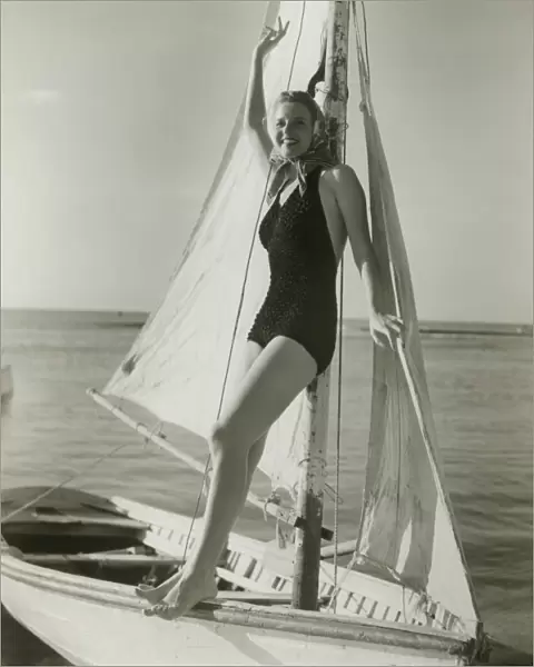 Young woman posing on sailboat
