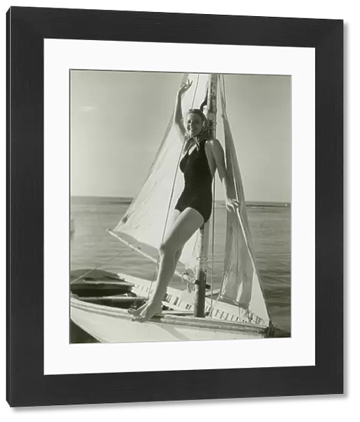 Young woman posing on sailboat