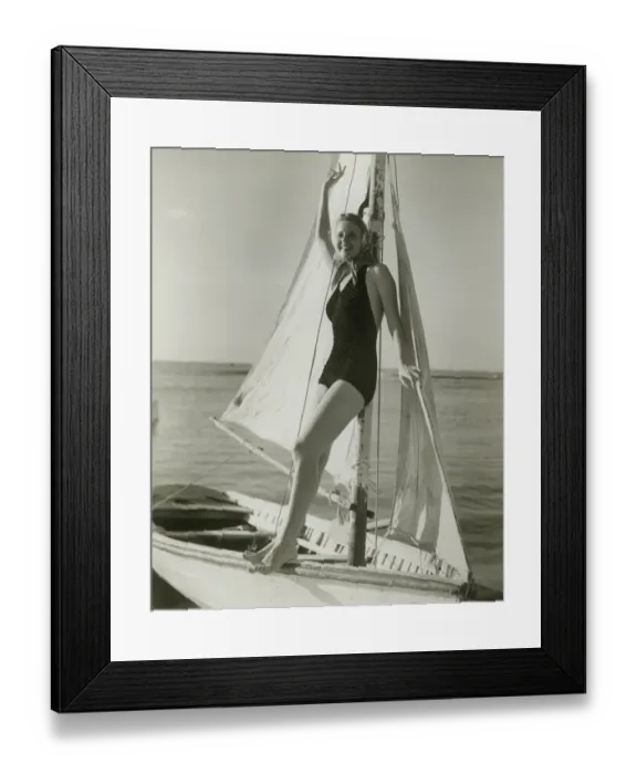 Framed Print : Young woman posing on sailboat