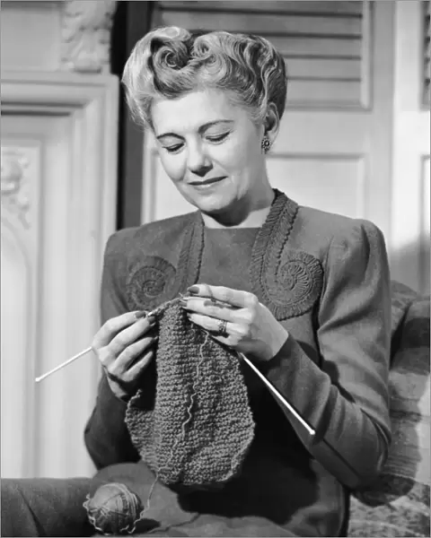 Portrait of mature woman crocheting