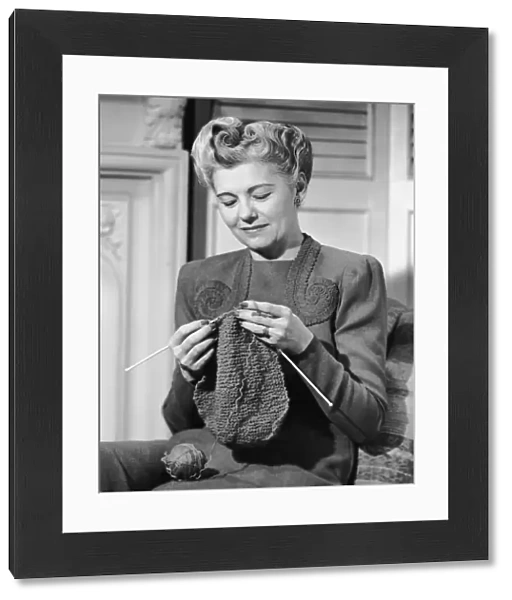 Portrait of mature woman crocheting