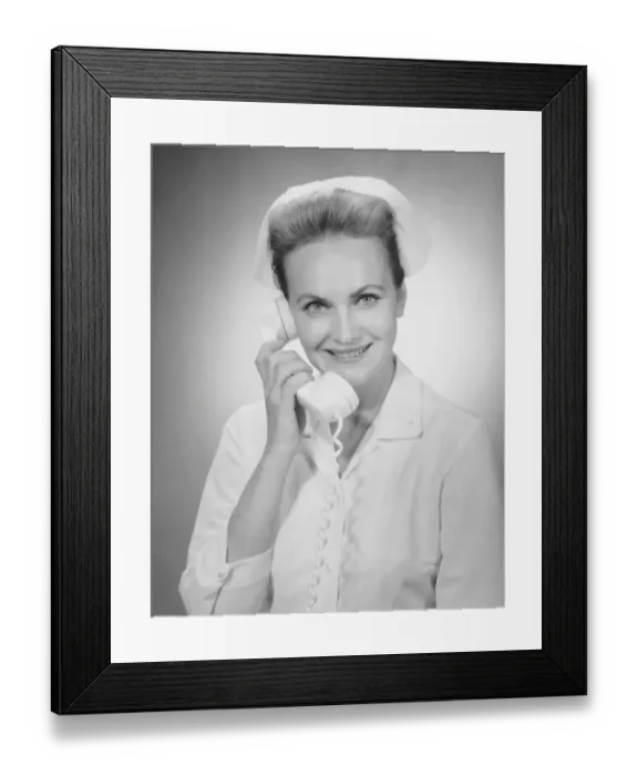Framed Print : Nurse talking on telephone