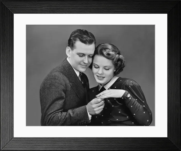 Framed Print : Man putting ring on womans finger Framed Print : Man putting ring on womans finger