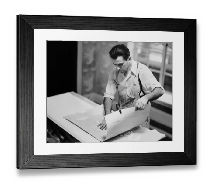 Framed Print : Carpenter putting on wallpaper Framed Print : Carpenter putting on wallpaper