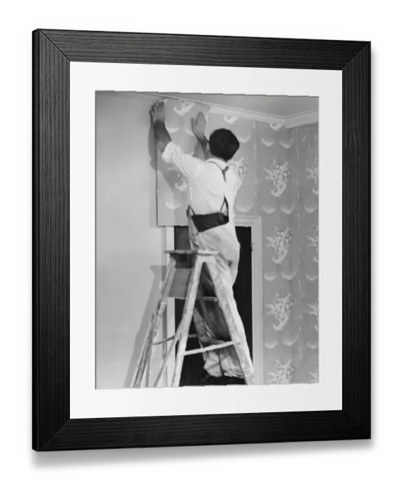 Framed Print : Man applying wallpaper