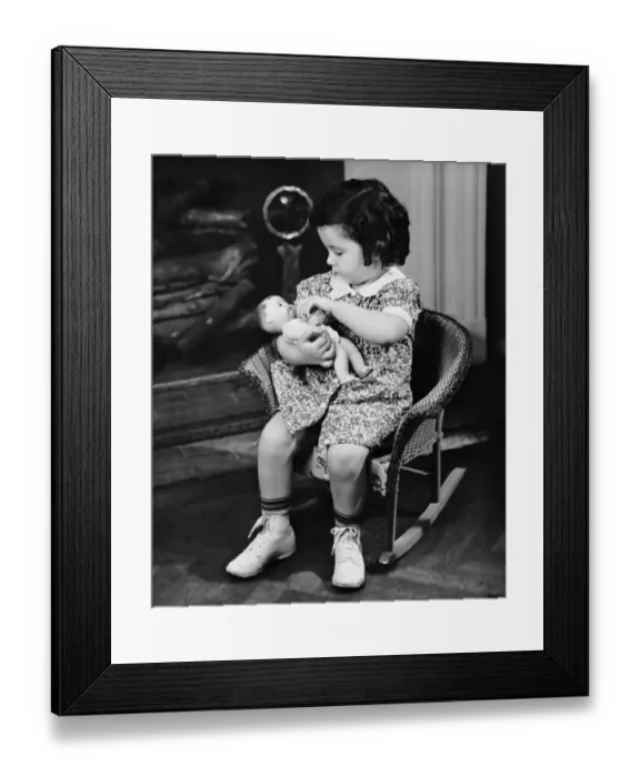Framed Print : Little girl playing with doll Framed Print : Little girl playing with doll