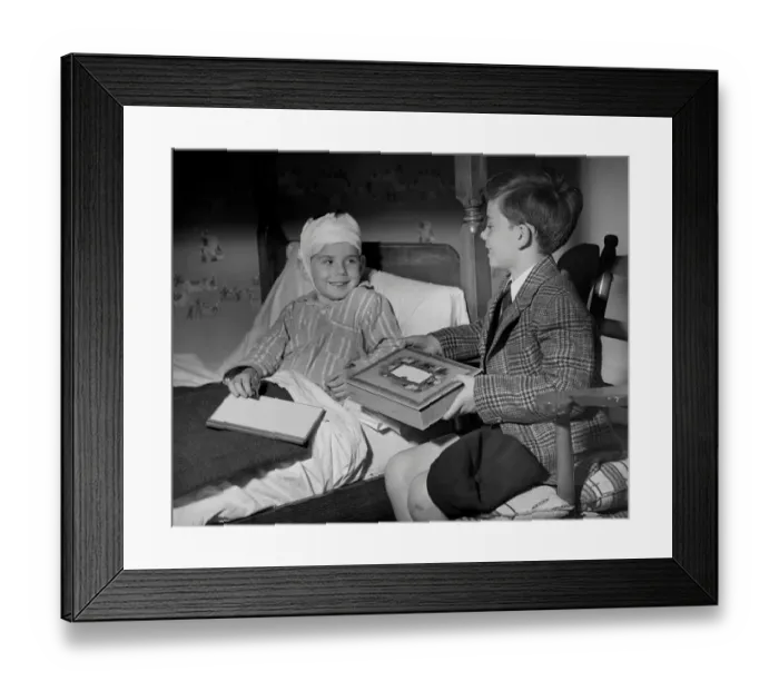 Framed Print : Young boy visiting sick friend Framed Print : Young boy visiting sick friend
