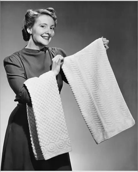 Woman holding up towels