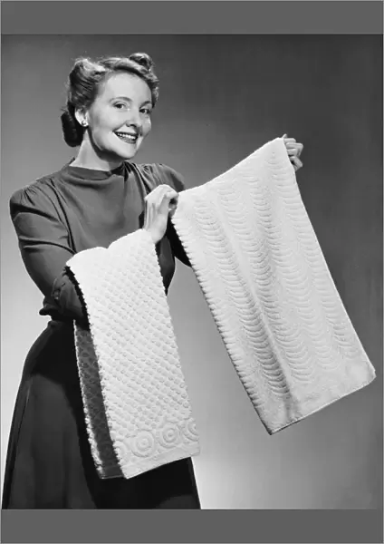 Woman holding up towels