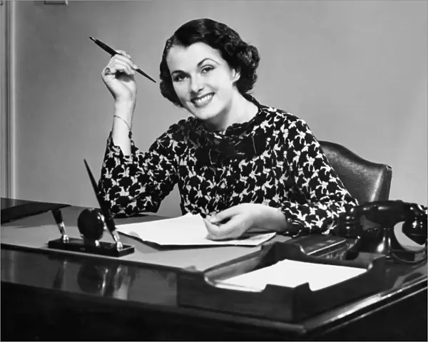 Portrait of businesswoman at desk
