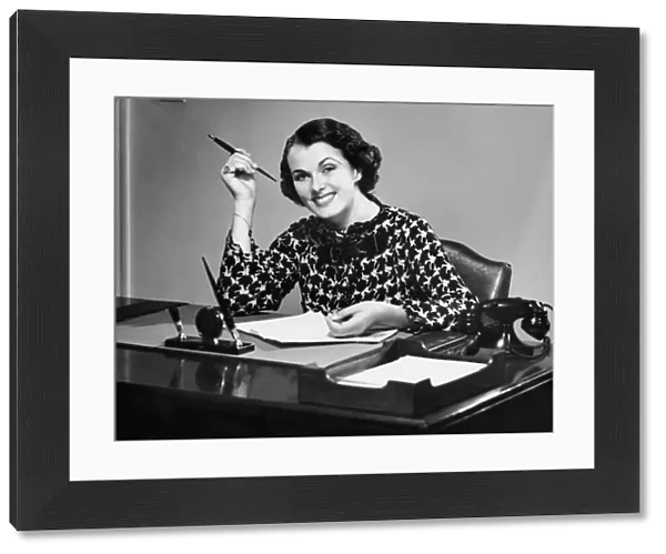 Portrait of businesswoman at desk