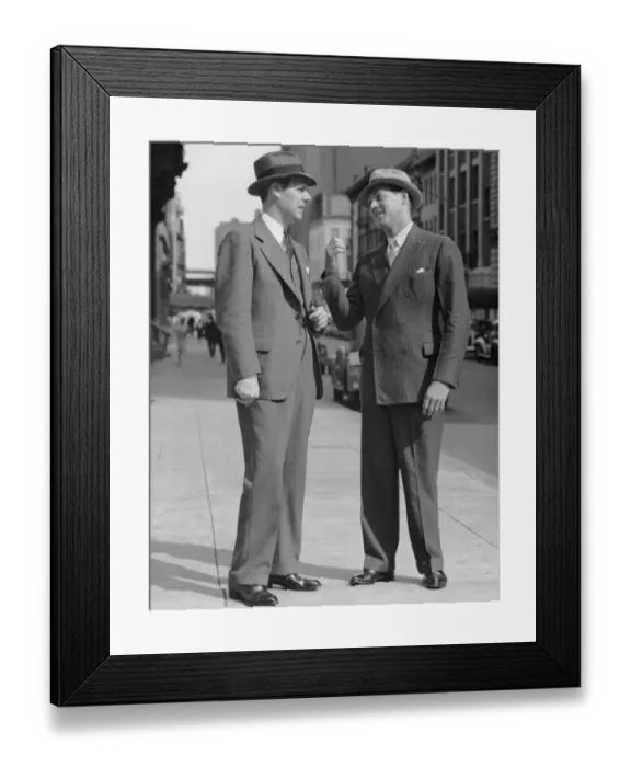 Framed Print : Two men talking on street