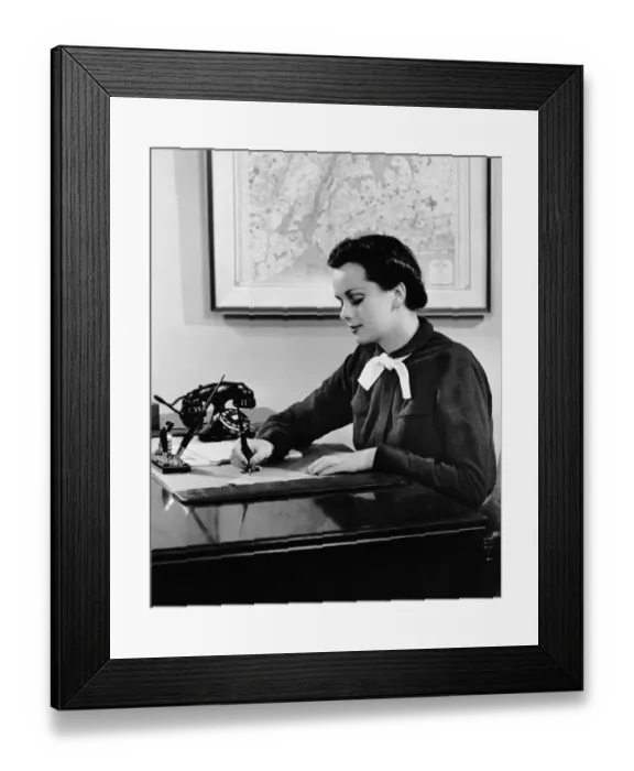 Framed Print : Woman writing at desk Framed Print : Woman writing at desk