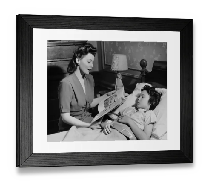 Framed Print : Mother reads child a bedtime story Framed Print : Mother reads child a bedtime story