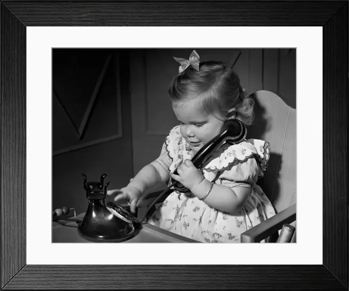 Framed Print : Baby playing w / phone Framed Print : Baby playing w / phone