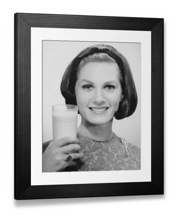 Framed Print : Woman holding glass of milk Framed Print : Woman holding glass of milk