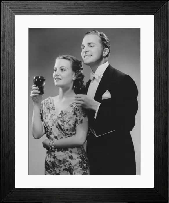 Framed Print : Couple dressed up holding drinks Framed Print : Couple dressed up holding drinks
