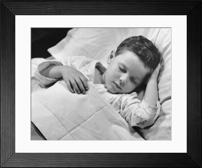Framed Print : Young boy asleep in bed Framed Print : Young boy asleep in bed