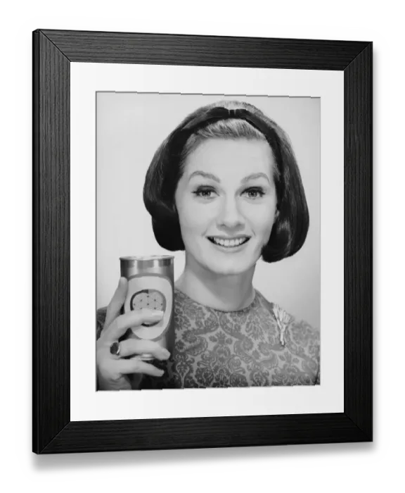 Framed Print : Woman holding up can of beer Framed Print : Woman holding up can of beer