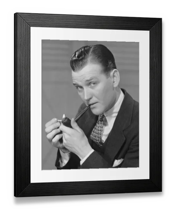 Framed Print : Portrait of businessman lighting pipe Framed Print : Portrait of businessman lighting pipe