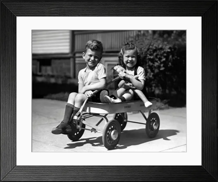 Framed Print : Boy & girl on wagon Framed Print : Boy & girl on wagon