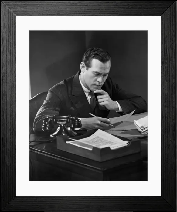 Framed Print : Businessman at desk Framed Print : Businessman at desk