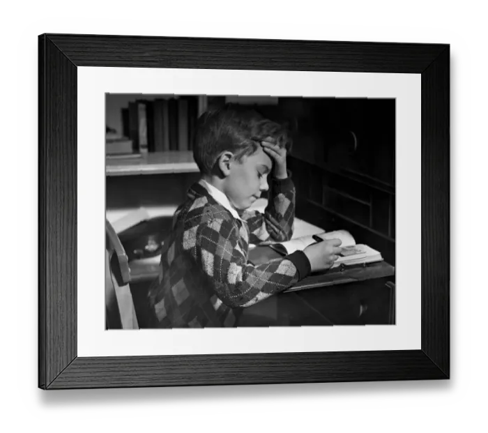 Framed Print : Boy in classroom w / book Framed Print : Boy in classroom w / book