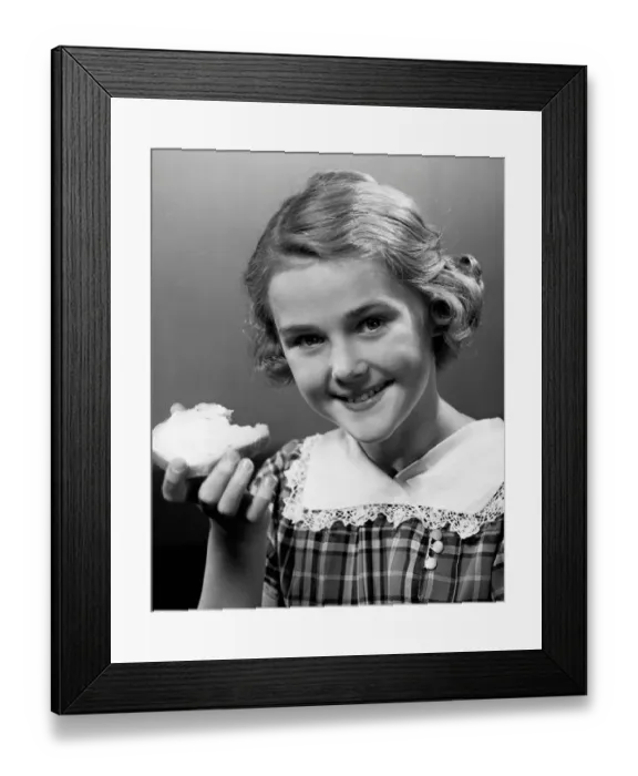 Framed Print : Girl eating bread Framed Print : Girl eating bread