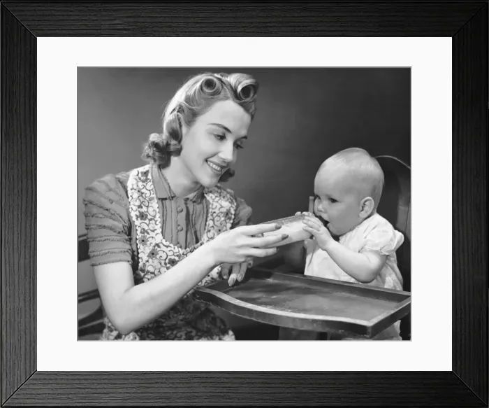 Framed Print : Mother holding bottle for baby Framed Print : Mother holding bottle for baby