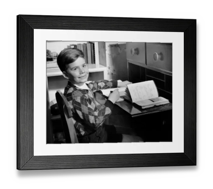Framed Print : Boy indoor at desk Framed Print : Boy indoor at desk